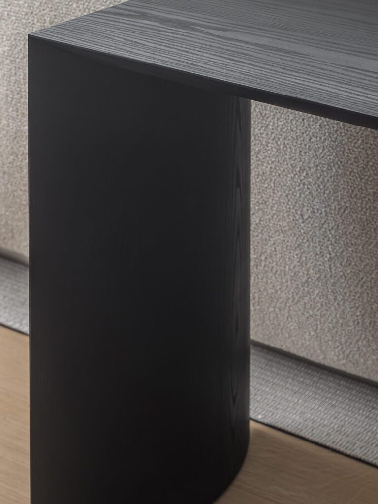 Detail view of the Moon Dresser from the Moon Collection, revealing its balanced proportions, curved base and solid oak material in dark tone, a statement of high-end furniture craftsmanship, designed by I+Y